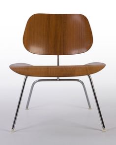 the eames chair is made from wood and metal