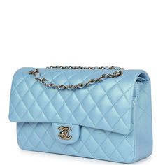 This Medium Classic Double Flap bag is in light blue iridescent calfskin leather with gold tone hardware and features a front flap with signature CC turnlock closure, half moon back pocket, and adjustable interwoven gold tone chain link and light blue leather shoulder strap.The interior is lined in light blue leather with the "love letter" zipper compartment under the first flap, an "outer" slit pocket is under the second flap, and an interior compartment with two open pockets separated by a "li Tiffany Blue Chanel Bag, Bri Aesthetic, Trending Handbags, Chanel Box, Purple Quilts, Pinterest Ideas, Trendy Handbags, Best Handbags, Trending Handbag