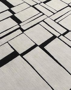 the shadows of squares and rectangles are cast on concrete