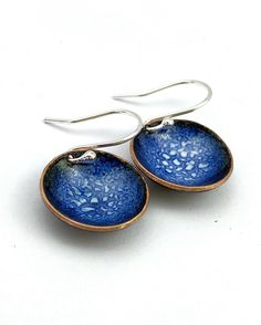 "A beautiful delicate pair of navy blue \"bowl\" shaped earrings hanging on sterling silver 925 hook wires. The \"bowls\" measure 16mmm - perfect for everyday wear. Copper discs were domed into little \"bowls\" and filled with white and ultramarine blue vitreous enamel and fired at 900 degrees. Several layers of enamel were applied to create patterns, depth and colour. The back of the earrings have been enamelled in black to provide strength and comfort. A perfect way to add a pop of colour to y Torch Fired Enamel Jewelry, Enameling Jewelry, Blue And White Earrings, Blue Drop Earrings, Bowl Pendant, Enamel Bowl, Enameled Copper, Moon Jewelry, Silver Work