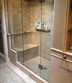 a walk in shower sitting inside of a bathroom