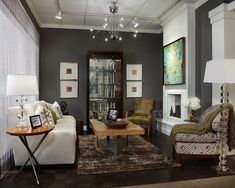 a living room filled with furniture and a fire place