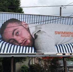 a billboard with a man's face on it