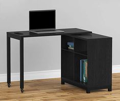 a computer desk with a laptop on top of it and a book shelf underneath the desk