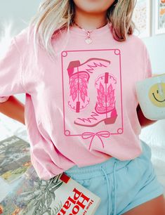 Grab this cute coquette pink cowgirl boots shirt. It's sure to become your new favorite! 🤩 Tip: THESE RUN TRUE TO SIZE. If you want an oversized look, size up 2-3 sizes. 😉 ✅ Shirt Information: ** Comfort Colors Unisex Shirt ** - 100% ring-spun cotton - Medium fabric - Relaxed fit ✅Design Printing Design printed using Direct to Garment (DTG) print technology. ✅ Care Instructions Due to the ink used in the design, please wash it inside out in cold water. Allow the item to air dry for lasting print quality. ✅ Processing time and Shipping It typically takes 4-7 business days to process orders in the US. However, around holidays or weekends, this time may be extended. Typically never to exceed 14 days in the US. ✅ Returns and Exchanges All of the products sold here are made-to-order. Meaning Lets Go Girls Shirt, Cowgirl Bachelorette Shirts, Cowgirl Lifestyle, Coquette Cowgirl, Lets Go Girls, Pink Cowboy Boots, Pink Cowgirl Boots, Pink Cowboy, Chemise Rose