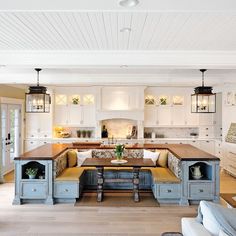 a large kitchen with an island in the middle and lots of counter space on one side