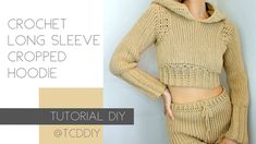 the crochet long sleeve cropped hoodie and shorts are shown in this video