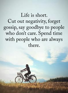 a person riding a bike in the middle of a field with a quote about life is short cut out negatively forget gossip, say goodbye to people who