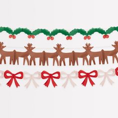 christmas paper garland with reindeers, holly and red bows on white background for holiday decoration