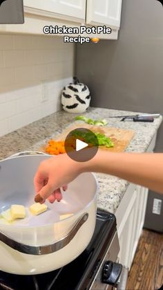 a person is cooking food in a pan on the stove and then flipping it over