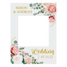 a wedding photo frame with flowers and greenery on the front, in gold lettering