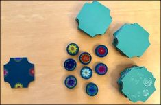 several pieces of paper are sitting on a table with holes cut out to make them look like hexagonals