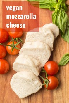 sliced mozzarella cheese on a cutting board with tomatoes and basil