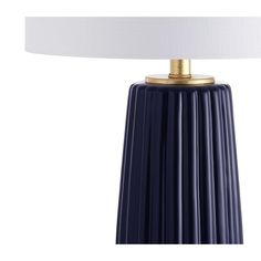 a blue table lamp with a white shade