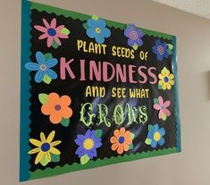 a sign on the wall that says plant seeds of kindness and see what grows in it