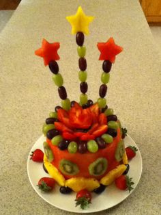 a cake made to look like it has fruit on top and stars in the middle