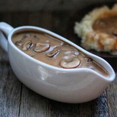 a spoon with some food in it on a table