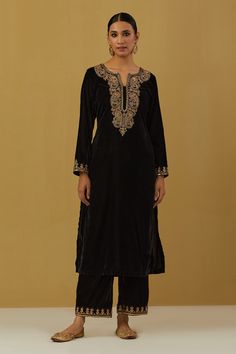 Black velvet silk embroidered kurta in paisley and floral motifs. Paired with pant.
Component: 2
Pattern: Embroidered
Type Of Work: Paisley, Floral
Neckline: Notched
Sleeve Type: Long
Fabric: Silk Velvet
Color: Black
Other Details: 
Note: Dupatta worn by the model is not for sale
Occasion: Sangeet - Aza Fashions Luxury Black Straight Kurta Churidar, Luxury Black Kurta With Naqshi Detailing, Luxury Black Kurta For Work, Luxury Velvet Kurta In Elegant Style, Luxury Velvet Straight Kurta, Luxury Velvet Kurta For Eid, Velvet Kurta, Kurta Pant Set, How To Hem Pants