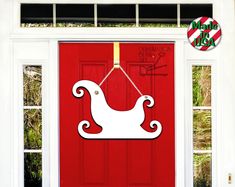 a red door with a white sleigh on it