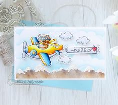 a card with an airplane and some flowers