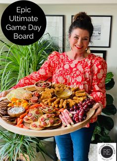 a woman holding a platter full of food