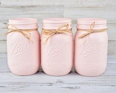 three pink mason jars tied with twine