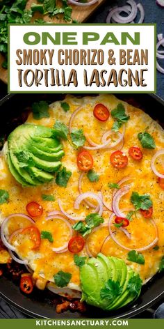 an omelet with onions, tomatoes and avocado on top in a skillet