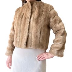 1970's Vintage Cropped Mink Brown Faux Fur Coat Jacket Size Small Great light brown faux fur coat with side pockets and 3 hook and eye closures at the front. The make is Matilda, Sydney. Hook and eye fastenings on the front.  It is in good used condition.  Labelled as a size 10, to fit bust 80cm/ waist 60cm. Measures 40 inches at the bust, 20 inches long. Vintage Fur Coat With Faux Fur Lining For Spring, Brown Fur Coat With Faux Fur Lining For Spring, Spring Brown Fur Coat With Faux Fur Lining, Brown Faux Fur Lined Coat For Spring, Brown Faux Fur Coat, Faux Fur Coat, Matilda, Light Brown, Fur Coat