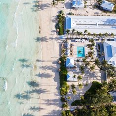 an aerial view of the beach and resort