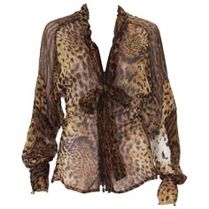 Tom Ford for Yves Saint Laurent Leopard Silk Top Blouse Fr. size - 38 S/S 2002 Collection 100% Sheer Silk, Leopard Print, Front Zip Closure Attached Ruffled Tie, Long Raglan Sleeves. Measurements: Length - 25 inches, Bust - 32, Waist - up to 27. Made in France Excellent Condition. Silk Tops Blouses, Gender Fluid Fashion, Leopard Blouse, Brown Blouse, Future Outfit, Vintage Fits, Leopard Print Blouse, Brown Leopard, Tie Blouse