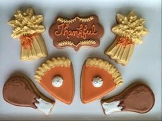 decorated cookies in the shape of thanksgiving pies