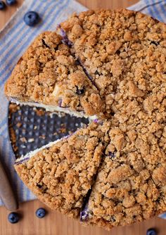 a blueberry crumb cake is cut into slices