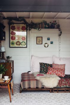 a living room filled with lots of furniture and decor on top of it's walls