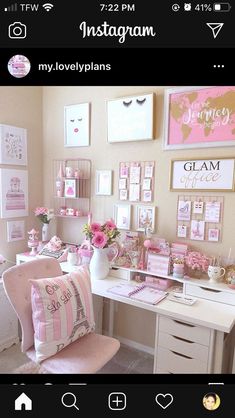 a room with pictures on the wall and pink furniture in front of it, including a desk