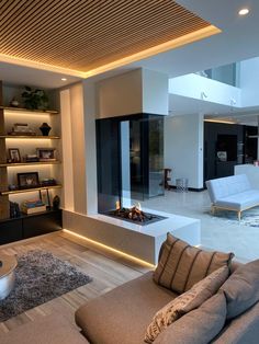 a living room with couches and a fire place