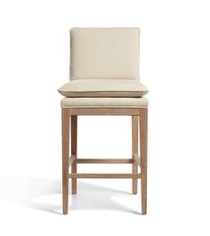 an upholstered bar stool with a seat cushion on the backrest and foot rest