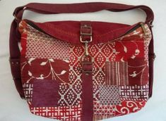 LaeSevilla bags Boho tapestry convertible backpack rucksack shoulder bag.   Measures approximately 11.5"H X 14"L X 4"W with 6" strap drop and adjustable backpack straps.  Red, purple, burgundy and orange tapestry with faux suede.  Features a top zippered closure and clasp, inside fully lined in gray fabric with a zippered pocket , slip pocket and pen slot.  Antique brass tone hardware.  Handmade in Spain.   This is a pre-owned new, unused item in excellent condition, see photos for full details/