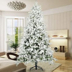 a white christmas tree in a living room