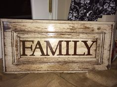 a wooden sign that says family on it