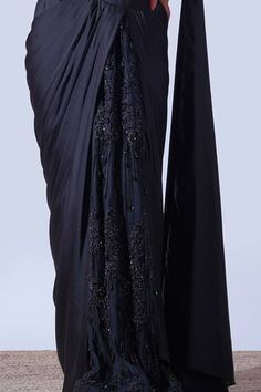 Black sleeveless padded draped V neck blouse with dangling beads embellishments. Paired with a pre-draped saree with tonal crystal gardenia embellishments on the centre saree skirt panel. - Aza Fashions Elegant Evening Pre-draped Saree With Resham Embroidery, Hand Embellished Pre-draped Saree For Designer Wear, Elegant Formal Pre-draped Saree With Resham Embroidery, Elegant Pre-draped Saree With Traditional Drape, Elegant Pre-draped Saree With Dupatta, Traditional Hand Embellished Pre-draped Saree For Evening, Elegant Draped Saree With Resham Embroidery, Traditional Hand Embellished Pre-draped Saree For Formal Occasions, Formal Hand Embellished Pre-draped Saree