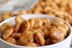 a white bowl filled with fried food on top of a table