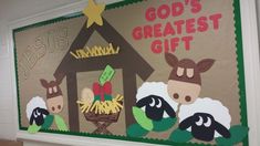 the bulletin board is decorated with sheeps and a mangero's house