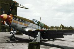 an old airplane sitting on top of a tarmac