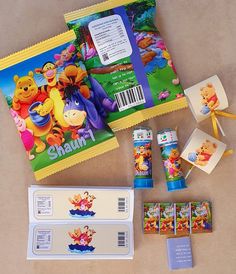 winnie the pooh party supplies including candy, stickers, and book wrappers