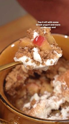 a spoon with some food in it on a table