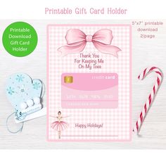 a pink and white checkered gift card with a candy cane, heart shaped lollipop