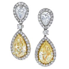 These Exquisite 18 Karat White Gold Diamond Earrings Feature 10.47 Carat Total Weight of Pear Shape & Round Brilliant White and Fancy Yellow Diamonds. These Stunning Earrings Have a GIA Certificate for each of the Rare Pear Shaped Diamonds!! #Yellowdiamond #PrincessCut #FancyYellowDiamond #HighJewelry #DiamondRing Fine Jewelry Yellow Diamond Wedding Earrings, Yellow Gold Diamond Pear-shaped Earrings, Luxury Pear-shaped Yellow Gold Diamond Earrings, Fancy Yellow Diamond Earrings, Luxury Yellow Diamond Drop Earrings, Yellow Diamond Jewelry, White Gold Diamond Earrings, Classy Earrings, White Diamond Earrings