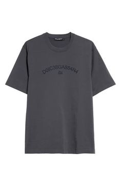 D&G's 'Stile' collection goes back to its iconic roots with a minimalist T-shirt entirely cut from fresh cotton and boasting a unique numerical logo graphic. Crewneck Short sleeves 100% cotton Dry clean Made in Italy Designer Clothing Fitted Cotton T-shirt With Band Logo, Stonewashed Cotton Band Merch T-shirt, Organic Cotton Logo Print T-shirt With Short Sleeves, Dolce And Gabbana Shirts, Dolce Gabbana T Shirt, Logo Graphic, Graphic Tshirt, Dolce And Gabbana, Short Sleeves