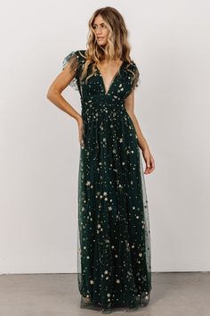 We're starstruck by this stunning dress! The Nova Shimmer Maxi Dress features gorgeous tulle material with a sparkling gold star pattern. Emerald Green Bridesmaid Dresses, Tulle Material, Bohemian Soul, Green Tulle, Baltic Born, Velvet Maxi Dress, Guest Attire, Green Bridesmaid, Green Bridesmaid Dresses