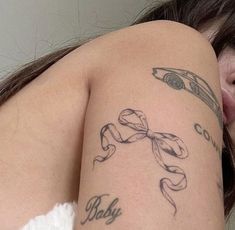 a woman with a tattoo on her arm